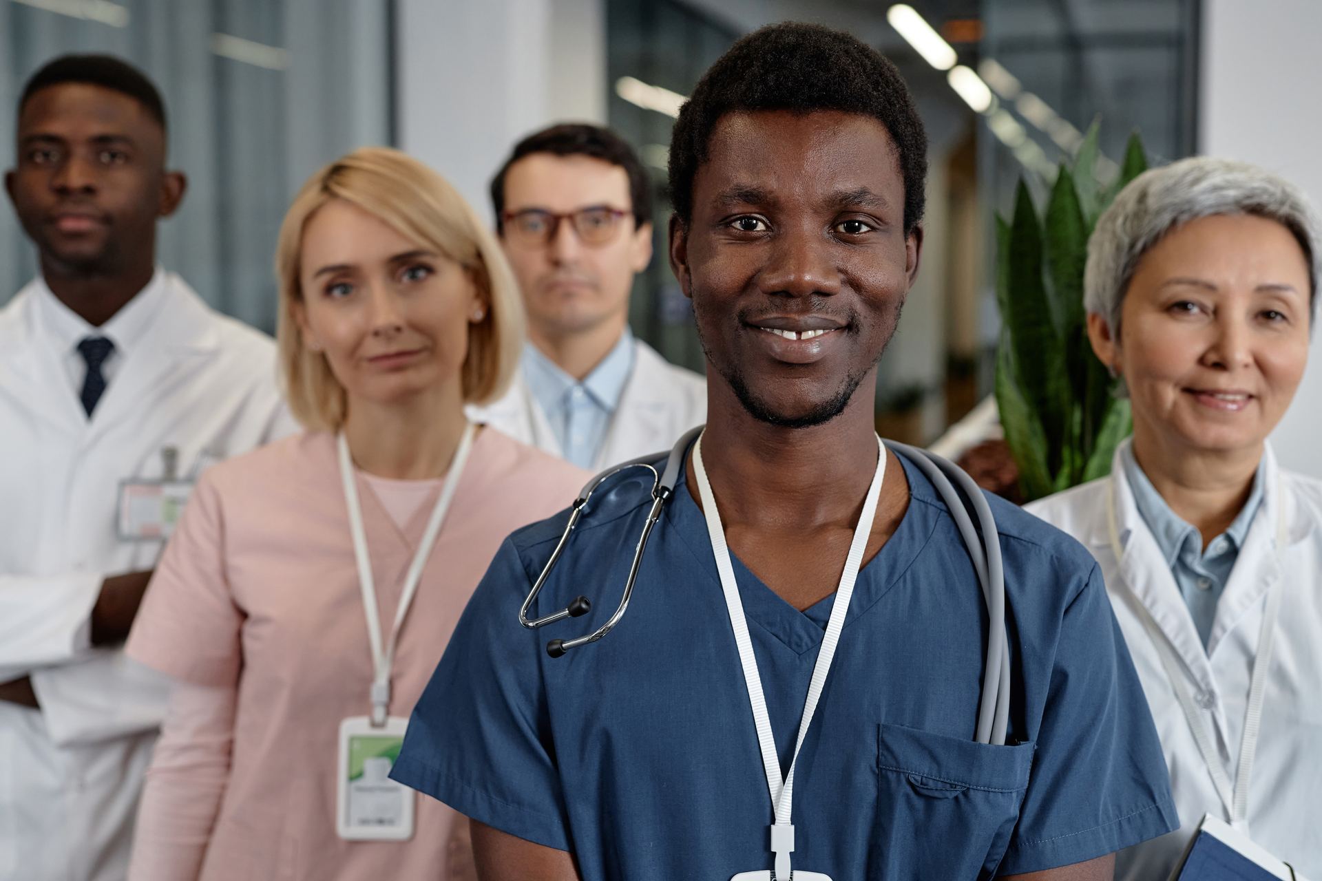 Dedicated team of medical professionals smiling together